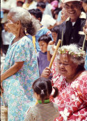 Wilcommen, No. 0041 Older Carolinian Woman in Mwáár Holding Dance Stick Smiles Down Toward Young Girl